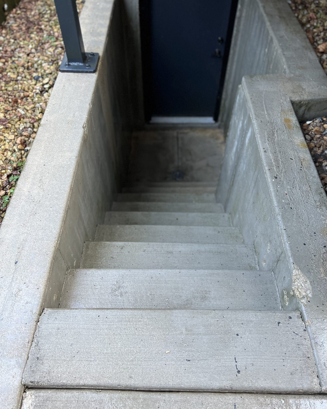 Clean concrete basement stairwell after power washing